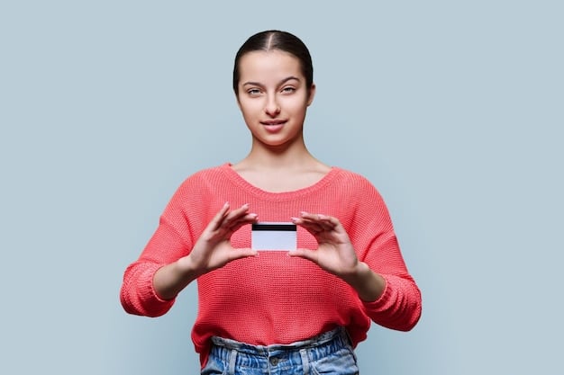 A person holding a debit card with the words 