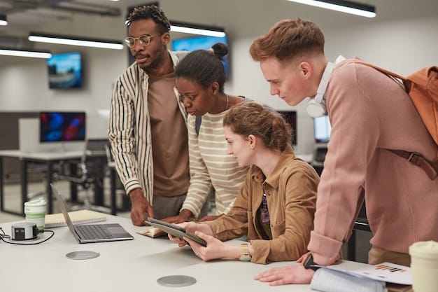 A diverse group of students collaborating on a project in a high-tech classroom, surrounded by screens displaying code and engineering schematics. The setting suggests a collaborative and innovative environment focused on technology and engineering.
